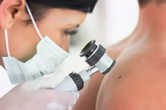 The dermatologist examines the nipples